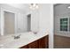 Bathroom boasts double sinks, white countertops, and a large mirror at 35 Pine Water Way, Spring Lake, NC 28390