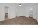 This bedroom has trey ceilings, a ceiling fan, ensuite bathroom, and walk-in closet at 35 Pine Water Way, Spring Lake, NC 28390