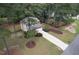 A well-manicured two-story home with a long driveway and charming curb appeal at 35 Pine Water Way, Spring Lake, NC 28390