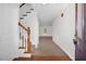 Bright foyer with hardwood floors, carpeted stairs, and natural light, creating a welcoming entrance at 35 Pine Water Way, Spring Lake, NC 28390