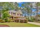 Charming two-story home with manicured landscaping, a stone facade, and a two-car garage at 35 Pine Water Way, Spring Lake, NC 28390