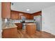 Beautiful kitchen features stainless steel appliances, granite counters, tile backsplash and a center island at 35 Pine Water Way, Spring Lake, NC 28390