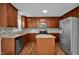 Well-equipped kitchen with stainless steel appliances, granite countertops, tile backsplash, and a functional island at 35 Pine Water Way, Spring Lake, NC 28390