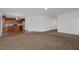Spacious living room leading into kitchen, featuring carpet flooring and ample natural light at 35 Pine Water Way, Spring Lake, NC 28390