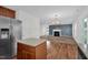 Stylish kitchen seamlessly flows into a cozy living room with a fireplace and elegant design at 35 Pine Water Way, Spring Lake, NC 28390