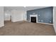 Spacious living room featuring a fireplace, neutral carpet, and ample natural light at 35 Pine Water Way, Spring Lake, NC 28390