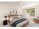 Bedroom with a large window for natural light, and stylish decor at 4002 Cherry Blossom Cir, Durham, NC 27713