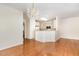 Open-concept dining area with chandelier, leading to the kitchen at 4002 Cherry Blossom Cir, Durham, NC 27713