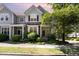 Charming two-story home with stone accents and lush landscaping at 4002 Cherry Blossom Cir, Durham, NC 27713