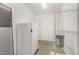 Walk-in pantry with shelving and a refrigerator for organized storage at 4002 Cherry Blossom Cir, Durham, NC 27713