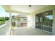 Outdoor balcony featuring a sliding glass door and views of the surrounding neighborhood and trees at 4024 Claret Ln, Morrisville, NC 27560