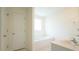 Bathroom features a double sink vanity and soaking tub at 4024 Claret Ln, Morrisville, NC 27560
