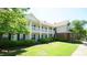 Two story condo building features second story outdoor balconies and manicured green landscaping at 4024 Claret Ln, Morrisville, NC 27560