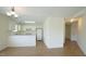 Open-concept kitchen and living area with wood floors and ample natural light at 4024 Claret Ln, Morrisville, NC 27560