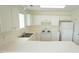 Bright kitchen with ample counter space, white cabinetry, and modern appliances at 4024 Claret Ln, Morrisville, NC 27560