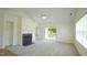 Inviting living room with fireplace, sliding glass doors, and a neutral color palette at 4024 Claret Ln, Morrisville, NC 27560