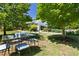 Backyard with a table and chairs surrounded by lush greenery at 416 Mitchell St, Hillsborough, NC 27278