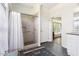 Bathroom featuring a tiled shower, shower curtain and decorative rug at 416 Mitchell St, Hillsborough, NC 27278