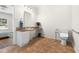 Accessible bathroom with a sink, toilet, and support bars for convenience at 416 Mitchell St, Hillsborough, NC 27278