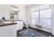 Bathroom with a large mirror, double sinks and an oriental rug at 416 Mitchell St, Hillsborough, NC 27278