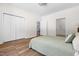 Spacious bedroom with hardwood floors, a bed, and a closet for ample storage at 416 Mitchell St, Hillsborough, NC 27278