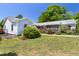 Landscaped backyard showcasing the home's screened porch and inviting outdoor living spaces at 416 Mitchell St, Hillsborough, NC 27278