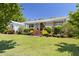 Charming single-story home featuring a beautifully landscaped front yard and welcoming front porch at 416 Mitchell St, Hillsborough, NC 27278
