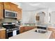 Kitchen featuring light countertops, stainless steel appliances, and tile backsplash at 416 Mitchell St, Hillsborough, NC 27278