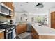 Well-equipped kitchen with stainless steel appliances, a central island, and bar seating at 416 Mitchell St, Hillsborough, NC 27278