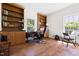 Bright home office with built-in bookshelves, wood floors and large windows at 416 Mitchell St, Hillsborough, NC 27278