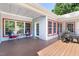 Covered back patio with outdoor furniture, offering space for outdoor living and entertaining at 416 Mitchell St, Hillsborough, NC 27278