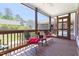 Relaxing screened porch with ceiling fan, outdoor seating, and views of the backyard at 416 Mitchell St, Hillsborough, NC 27278