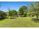 Expansive lawn dotted with mature trees, offering a peaceful outdoor space at 416 Mitchell St, Hillsborough, NC 27278