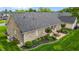 Aerial view of backyard featuring a concrete patio with dining set and well-manicured landscaping at 4589 Freedom Dr, Burlington, NC 27215