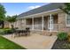 Covered patio with an outdoor dining set, great for entertaining guests and enjoying the outdoors at 4589 Freedom Dr, Burlington, NC 27215