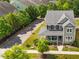 Beautiful aerial view of a home with green siding and a charming front porch at 508 Vervain Way, Holly Springs, NC 27540