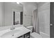 Bathroom featuring a single vanity and shower-tub combo at 508 Vervain Way, Holly Springs, NC 27540