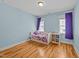 Charming bedroom with hardwood floors and natural light at 508 Vervain Way, Holly Springs, NC 27540