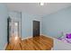 Bright bedroom with hardwood floors and ample space at 508 Vervain Way, Holly Springs, NC 27540