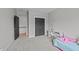 View of the bedroom showcasing neutral walls, gray closets and a desk at 508 Vervain Way, Holly Springs, NC 27540