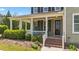 Inviting front porch with comfortable seating, perfect for relaxing outdoors at 508 Vervain Way, Holly Springs, NC 27540