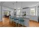 Spacious kitchen with modern appliances and an island with seating, ideal for casual dining at 508 Vervain Way, Holly Springs, NC 27540