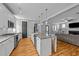 Open-concept kitchen with a large island, perfect for cooking and socializing at 508 Vervain Way, Holly Springs, NC 27540