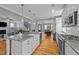 Bright kitchen featuring a center island, stainless appliances, and open layout at 508 Vervain Way, Holly Springs, NC 27540