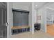 Mud room with custom bench, storage, coat rack, and a built-in desk, providing organized space at 508 Vervain Way, Holly Springs, NC 27540