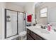 Modern bathroom featuring a clear glass shower and vanity with chrome hardware at 51 Balboa Parkway Pkwy, Clayton, NC 27520