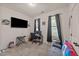 Functional bedroom with neutral carpet, television, desk, and convertible futon at 51 Balboa Parkway Pkwy, Clayton, NC 27520