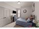 Comfortable bedroom with neutral walls, plush carpet, TV, and cozy decor at 51 Balboa Parkway Pkwy, Clayton, NC 27520