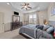 Comfortable bedroom featuring a ceiling fan, large dresser, and carpet at 51 Balboa Parkway Pkwy, Clayton, NC 27520