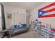 Cozy bedroom with a unique display of shoe collection and Buffalo Bills decor at 51 Balboa Parkway Pkwy, Clayton, NC 27520